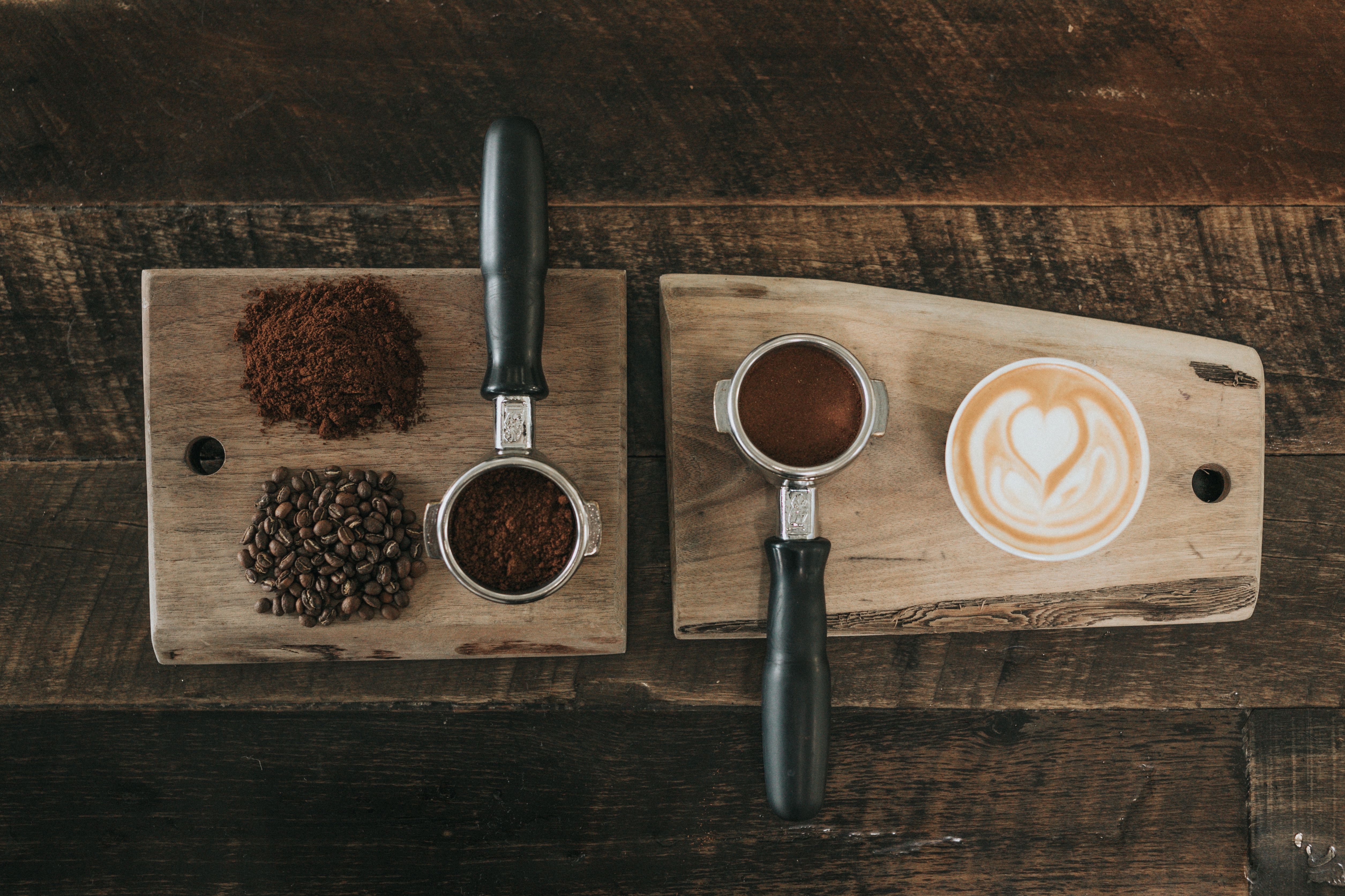 coffee grains and coffee measuring cups on wood